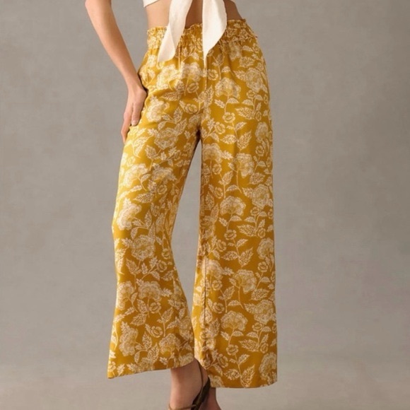Anthropologie Pants - ANTHROPOLOGIE wide leg pull on yellow/orange with white flower patterned pants
